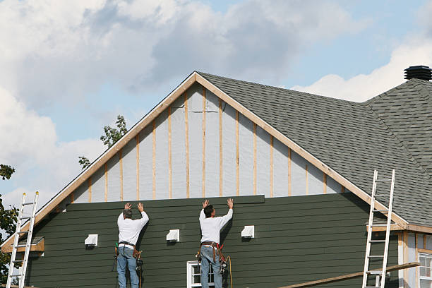 Professional Storm Damage Siding Repair technician working in Jacobsburg, OH